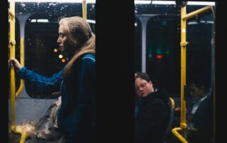 photo-of-a-woman-standing-inside-bus