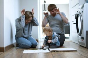 father-and-mother-playing-with-their-son