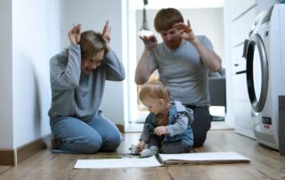 father-and-mother-playing-with-their-son